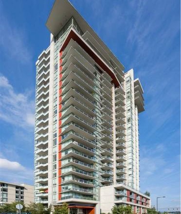 Modern high-rise condominium building in Vancouver with spacious balconies and contemporary architecture for luxury urban living.