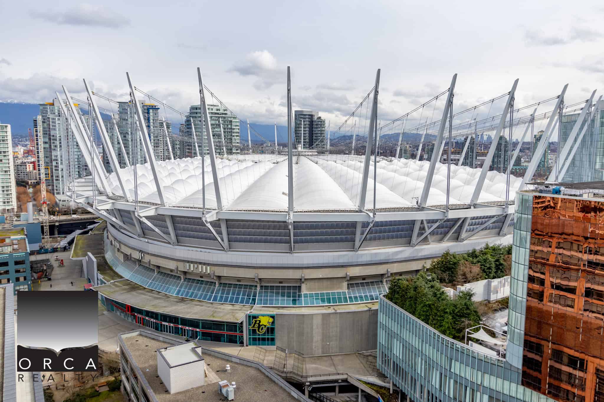 20 Modern Rogers Arena in Vancouver, a premier real estate and commercial property offering, surrounded by high-rise buildings, providing excellent investment opportunities in BC.