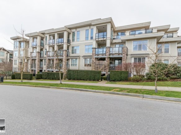 Modern multi-storey residential apartment building in Vancouver, BC, showcasing contemporary architecture with large windows, balconies, and landscaped surroundings, ideal for real estate investment or living.