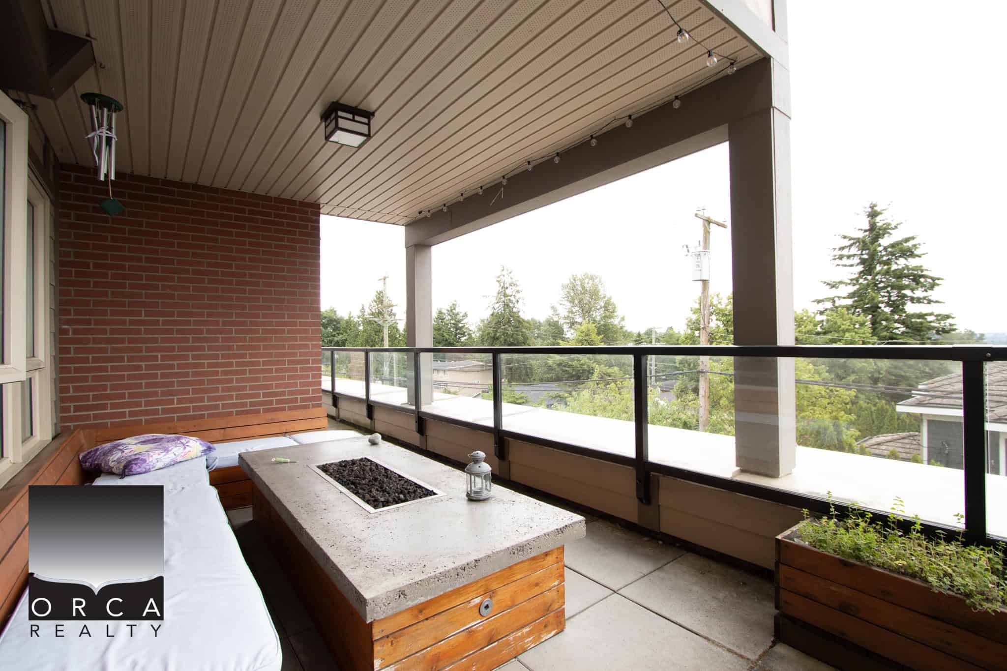 Spacious outdoor balcony with modern seating area and scenic views, ideal for relaxation in Vancouver. Perfect for enjoying the outdoors, entertaining guests, or watching sunsets from your home.
