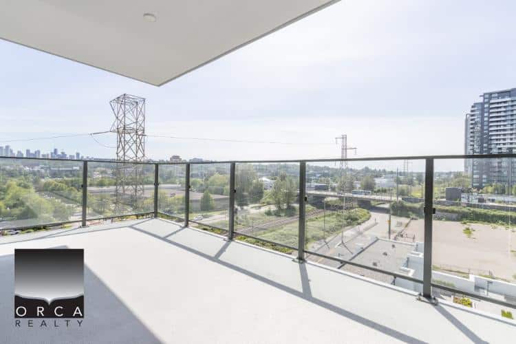 Modern balcony with city and green views in Vancouver, BC - Orca Realty Inc.