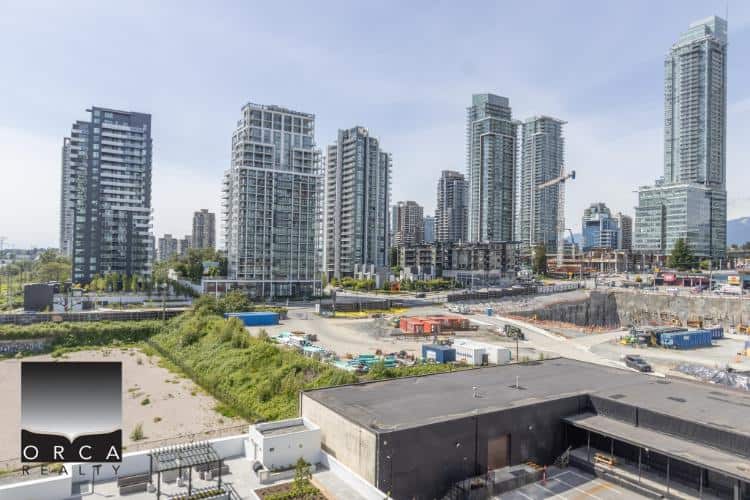 Vacant urban construction site in downtown with high-rise condominiums and modern buildings, showcasing real estate development opportunities in Vancouver.