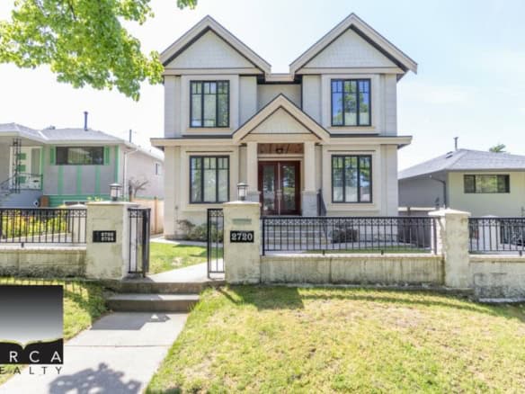 Modern two-story home for sale in Vancouver, BC, showcasing excellent curb appeal and prime real estate location offered by Orca Realty Inc.