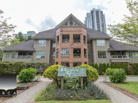 Modern multi-family residential building in Vancouver, BC, featuring contemporary architecture, landscaping, and outdoor greenery, ideal for real estate investment and property management in BC.