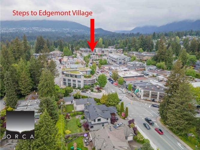 Spacious residential neighborhood in Edgemont Village, Vancouver, with modern homes and lush green trees, highlighted with steps to Edgemont Village, showcasing the area’s real estate appeal.