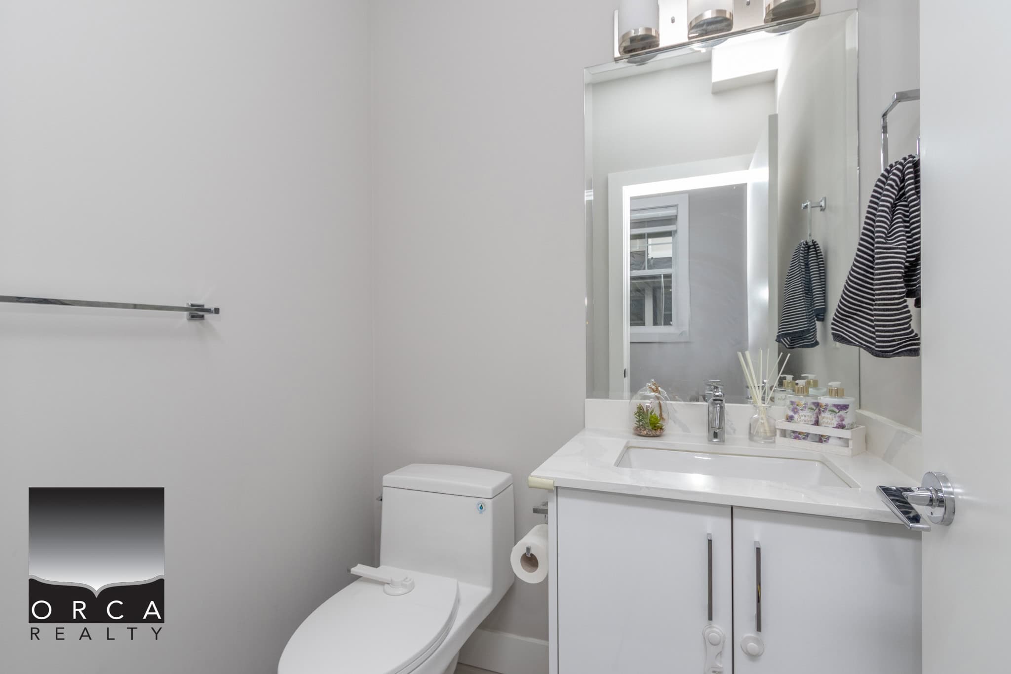 16 Modern Vancouver bathroom featuring white cabinetry, sleek fixtures, and natural light, perfect for contemporary home living.