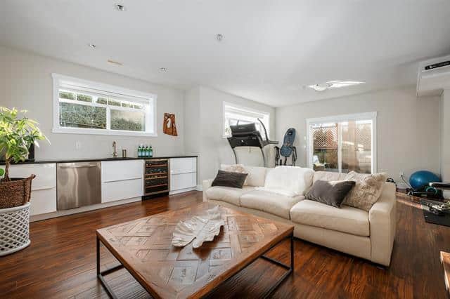 Bright and spacious living room with natural light, modern decor, hardwood flooring, and cozy seating, ideal for home living and relaxing in Vancouver area.