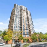 Modern high-rise residential building in downtown Victoria BC, featuring spacious balconies, contemporary design, and prime location for real estate investment and condo living.