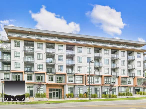 Contemporary multi-storey residential building featuring modern architecture, large windows, and spacious balconies, located in Vancouver, BC - ideal for real estate investment and upscale urban living.