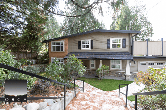 Charming two-storey family home with landscaped garden and modern updates, available through Orca Realty Inc. Serving Vancouver Island and BC for expert real estate services.