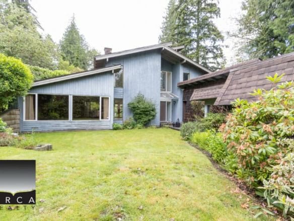 Charming modern house with lush green garden, ideal for Vancouver real estate investment, available through Orca Realty Inc., your trusted Vancouver realtor.