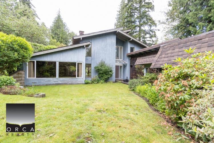 Charming modern house with lush green garden, ideal for Vancouver real estate investment, available through Orca Realty Inc., your trusted Vancouver realtor.