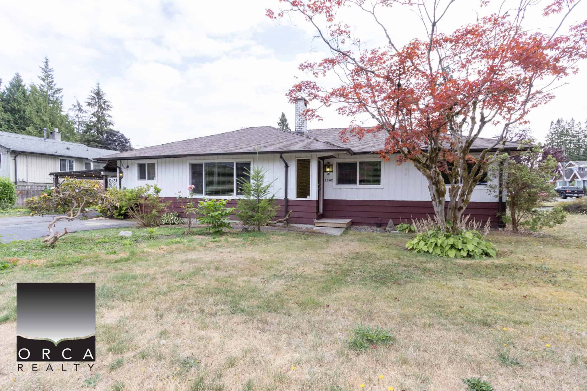 01 Charming single-family home with landscaped yard in a peaceful neighbourhood, perfect for buyers seeking a cosy residence with mature trees and outdoor space in Vancouver Island.