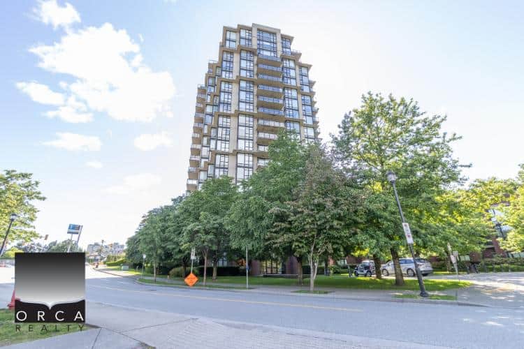 Luxurious high-rise condo building in downtown Vancouver showcasing modern architecture and urban living. Prime real estate listing by Orca Realty Inc. for Vancouver property buyers.