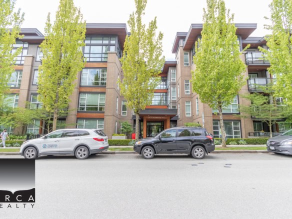 Contemporary multi-family residential building with modern architecture, large windows, and green landscaping, part of Orca Realty Inc. property listings in Vancouver, BC.