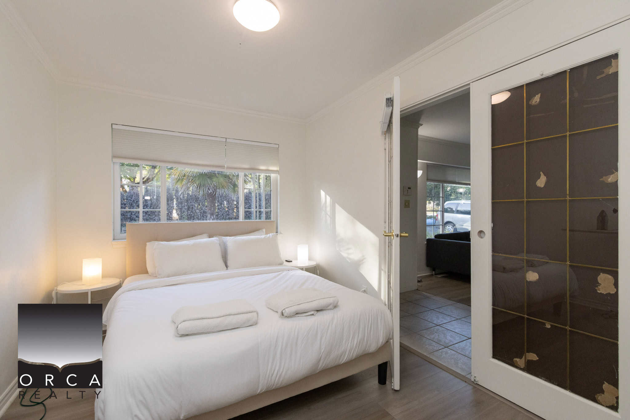 11 Bright and inviting bedroom in a Vancouver-area home, featuring modern décor, natural light from large windows, and a peaceful ambiance, ideal for real estate listings and showcasing local properties.