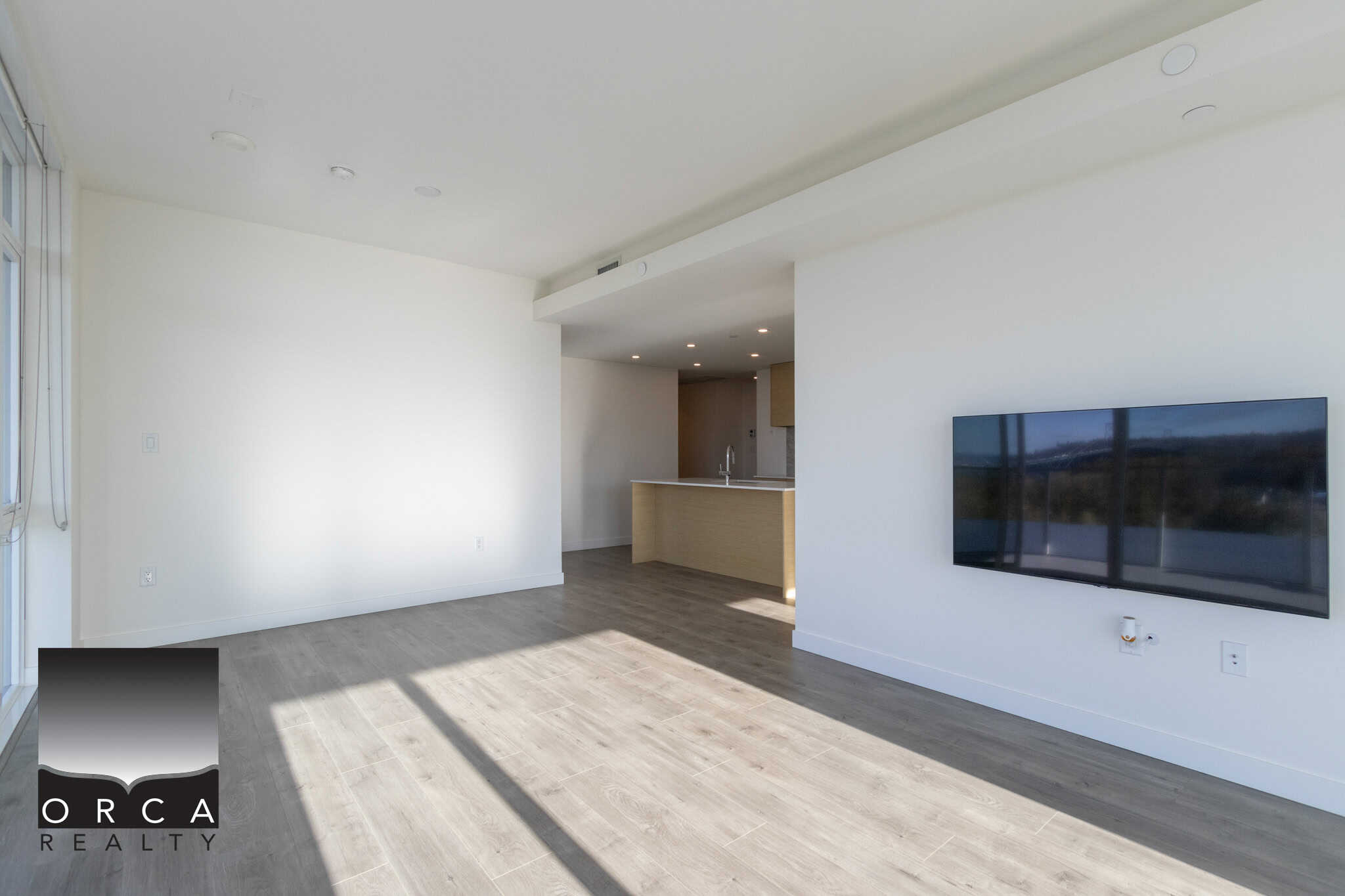 Modern unfurnished living room with large windows and bright natural light, open concept design, sleek minimalist decor, perfect for Toronto Ontario condos or Vancouver luxury apartments.