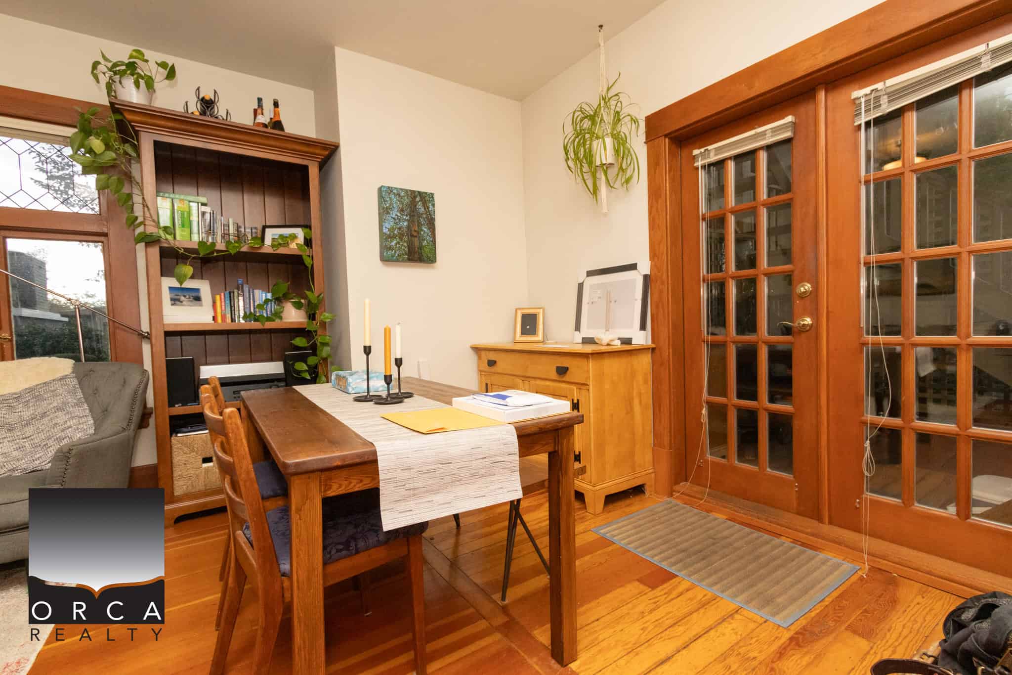 13 Cozy dining area with wooden furniture and large glass doors, perfect for family meals and gatherings in a warm, inviting home environment.