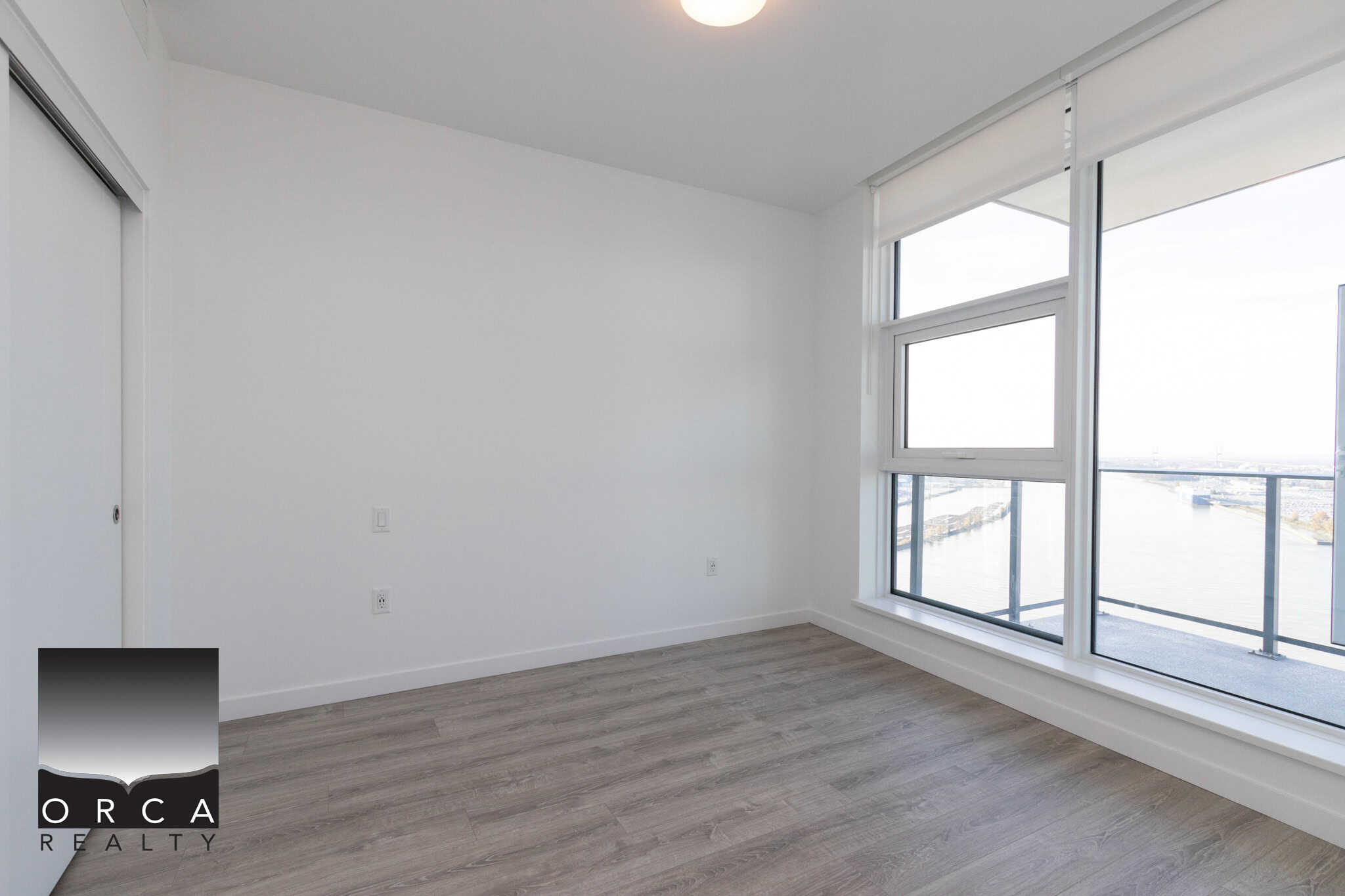 15 Modern Harbourview Apartment Interior with Large Windows - Orca Realty Inc.
