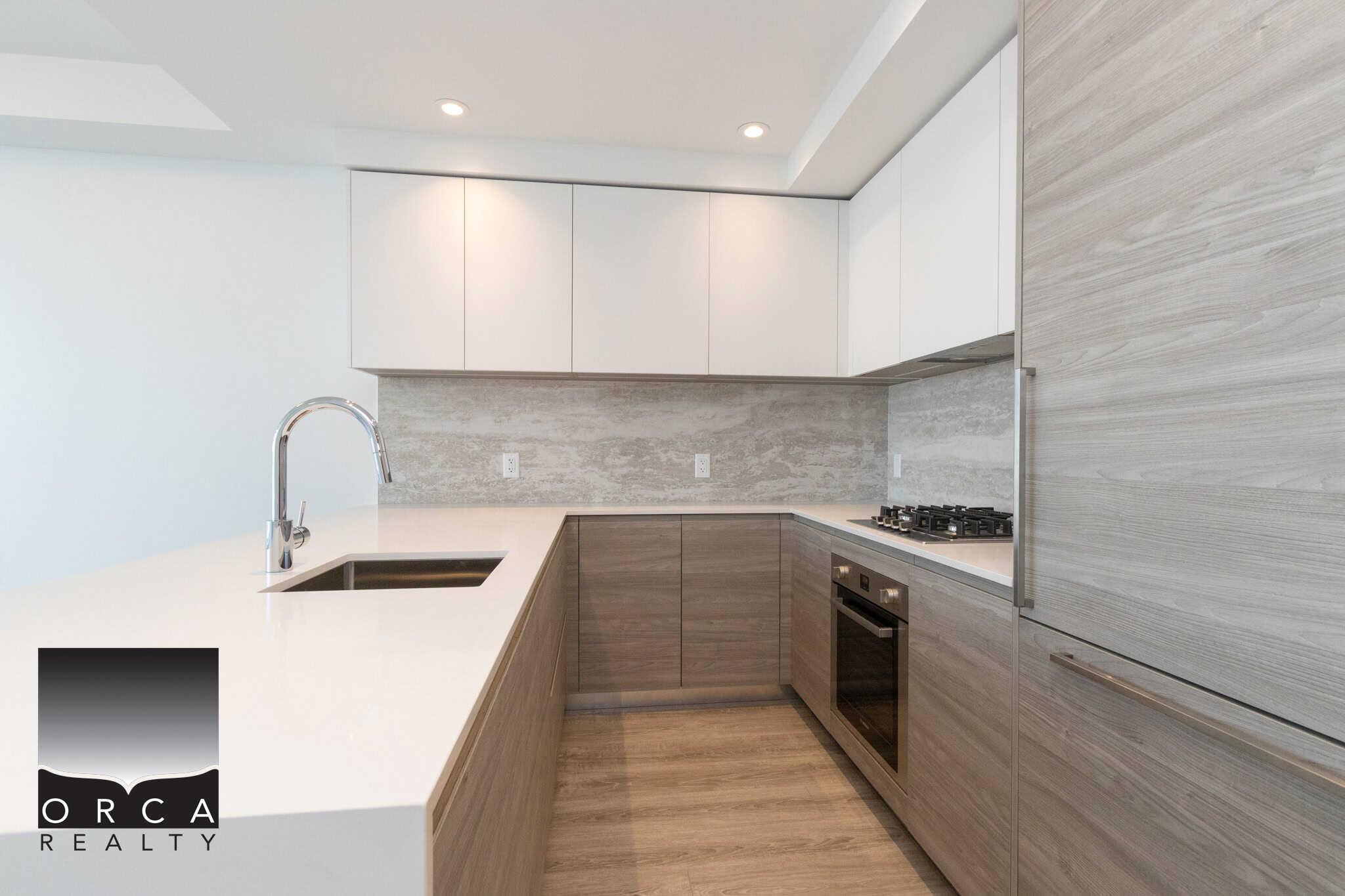 16 Contemporary modern kitchen with sleek white and light wood cabinetry, stainless steel appliances, and minimalist design, perfect for Vancouver real estate buyers.