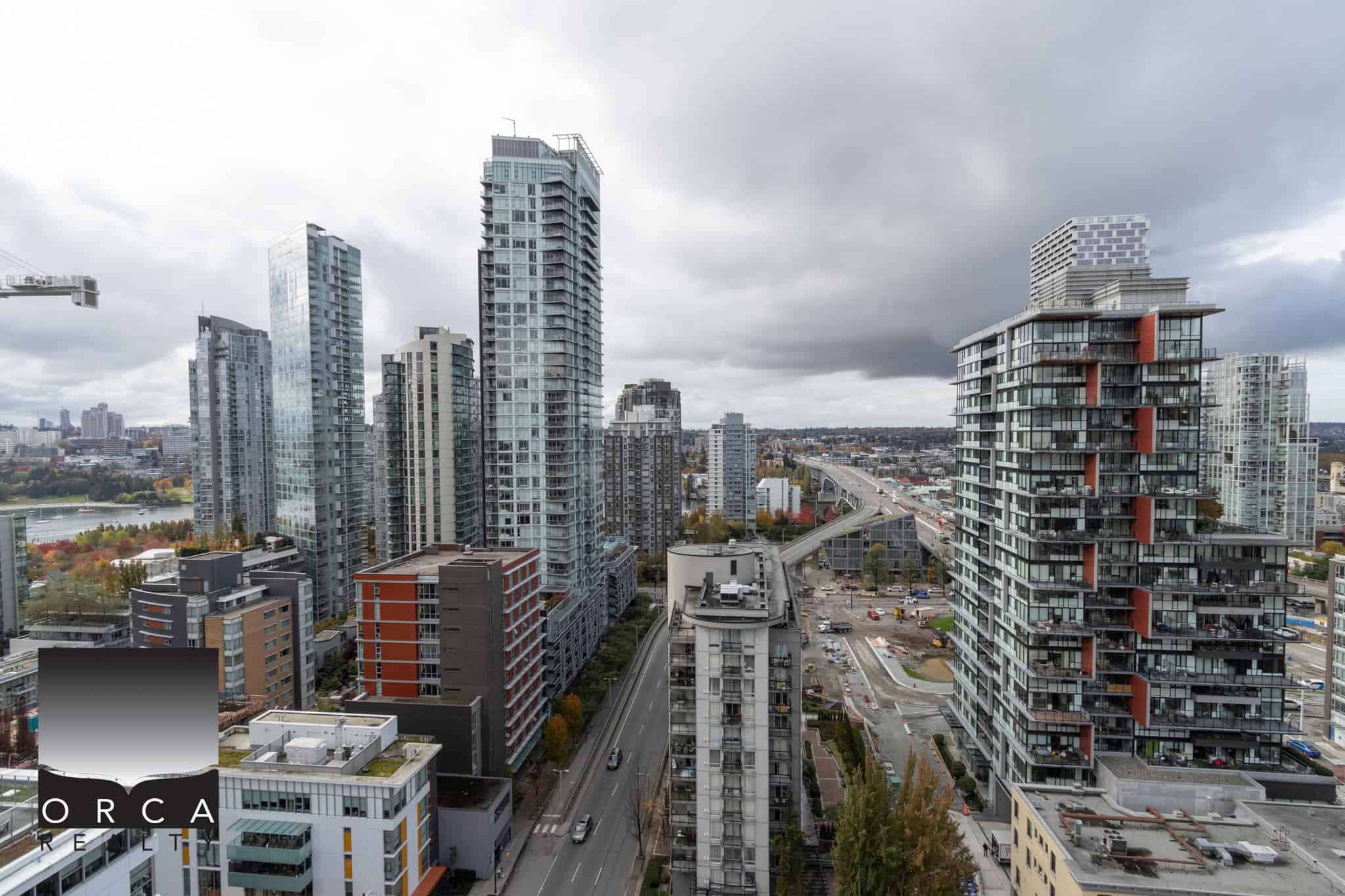 Vibrant cityscape featuring modern high-rise condos and residential buildings in Vancouver, British Columbia, showcasing contemporary urban living and downtown Vancouver real estate opportunities.