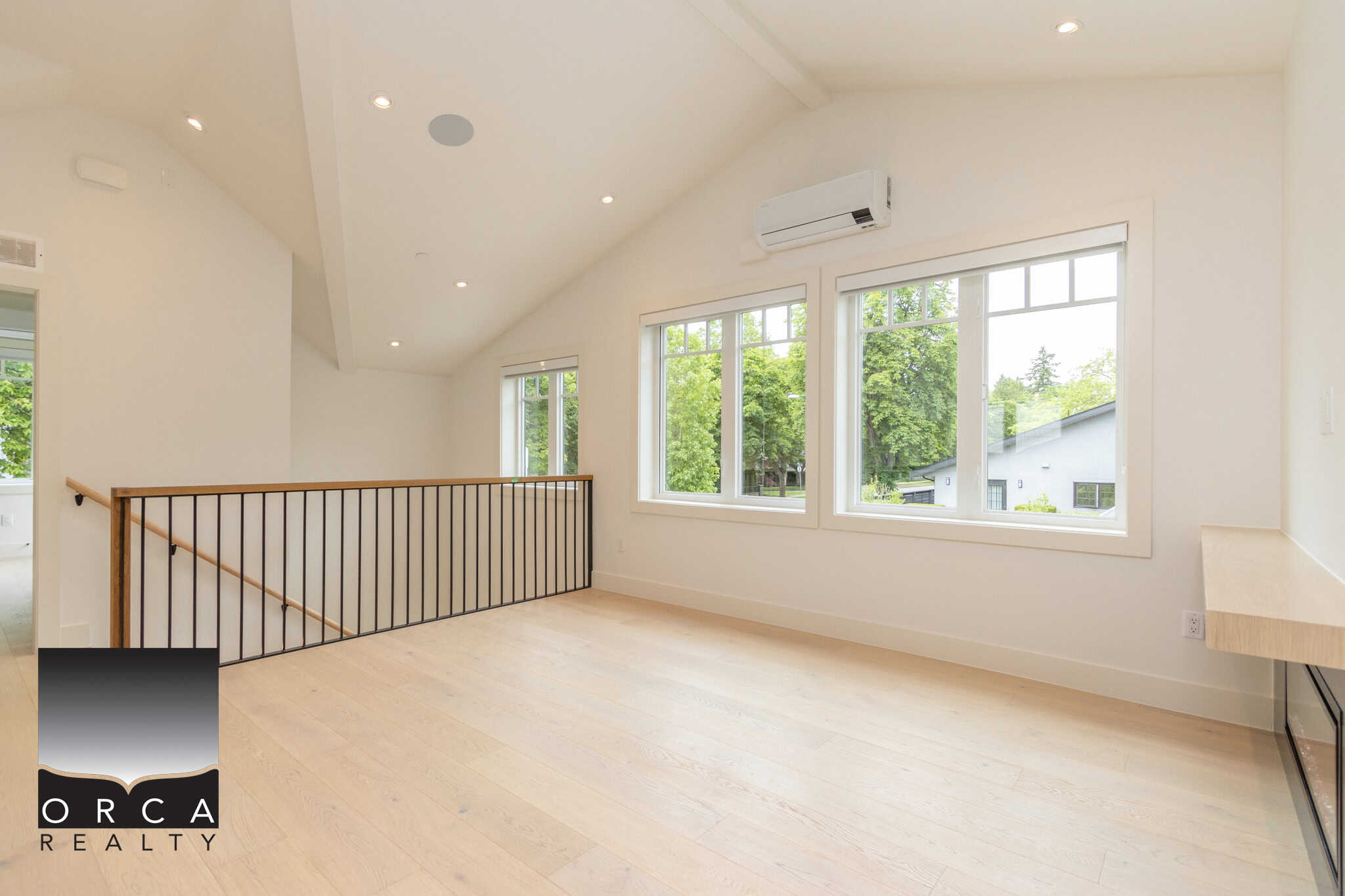 Bright and airy upper floor room with large windows, modern design, and natural light, perfect for a Vancouver Island home.