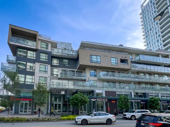 Contemporary mixed-use residential and commercial building in Vancouver with retail stores, including a Scotiabank branch, office spaces, and modern apartments, showcasing urban luxury living.