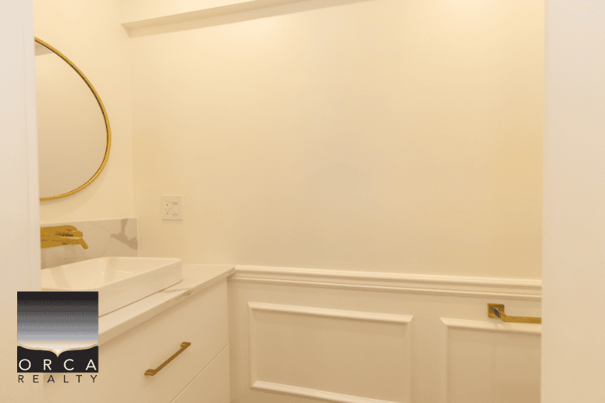 Modern interior bathroom vanity with gold accents and elegant design, showcasing high-quality finishes and contemporary style. Perfect for real estate listings and home staging.