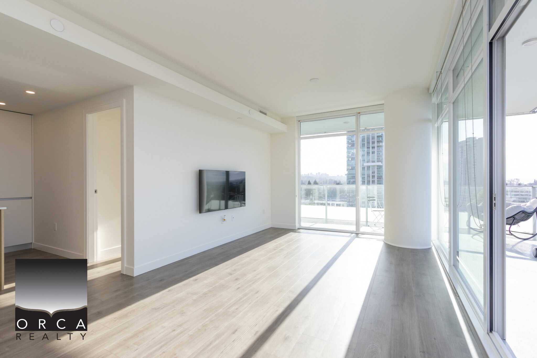 Modern downtown Vancouver condo living with spacious open-plan design and floor-to-ceiling windows showcasing city views – ideal for luxury real estate buyers.