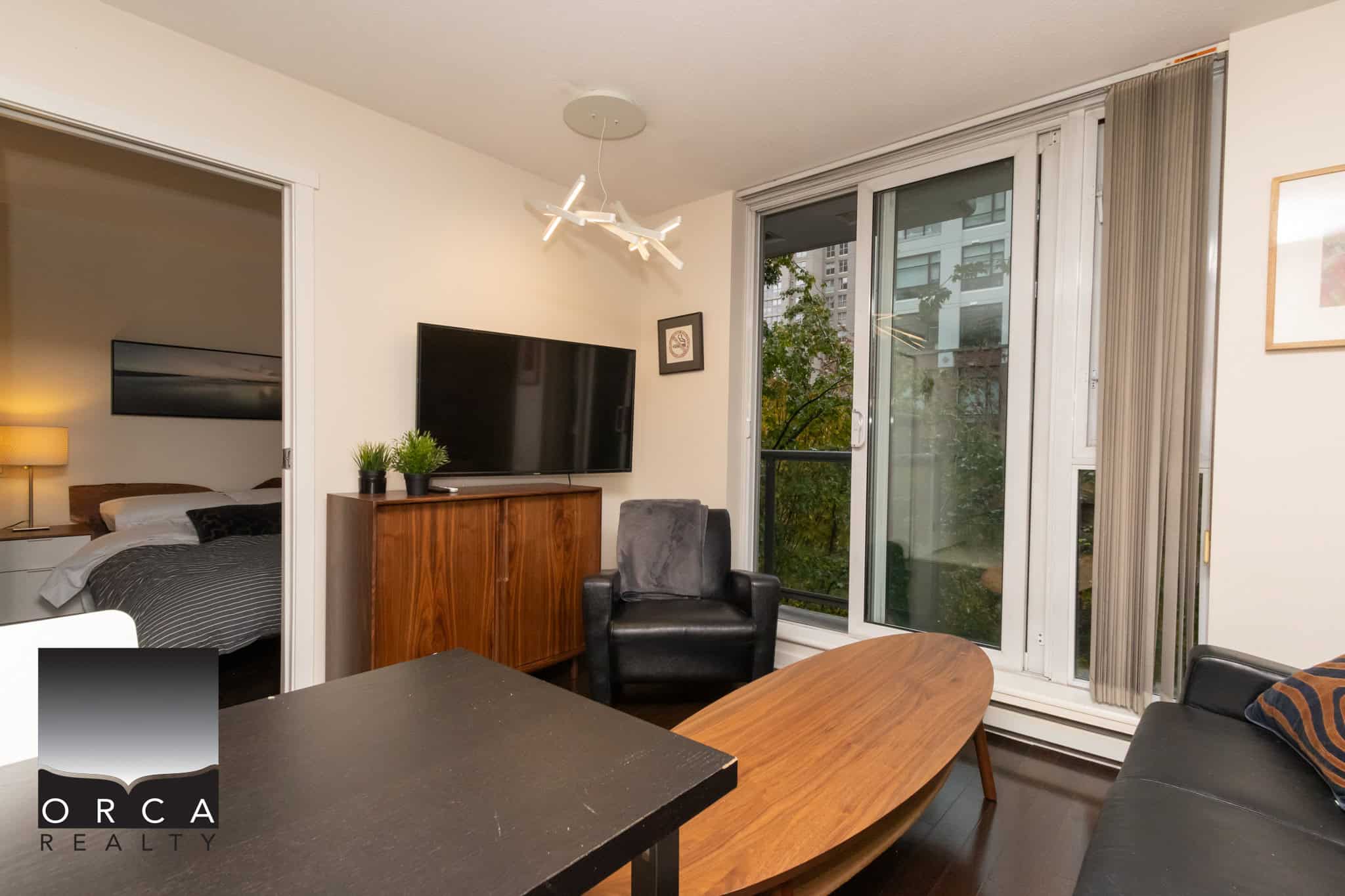 Modern Vancouver apartment living room with large windows, contemporary furniture, and city views - ideal for buyers seeking upscale condos.