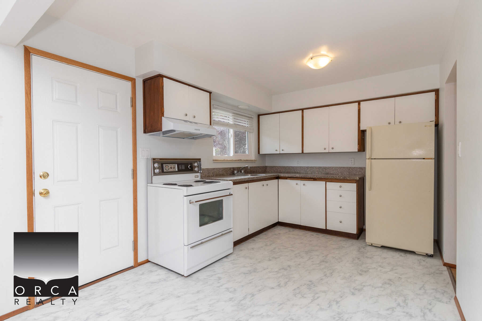 5 Kitchen with white cabinets, vintage refrigerator, and electric stove in a cozy home, ideal for buyers seeking affordable real estate options in Ontario.