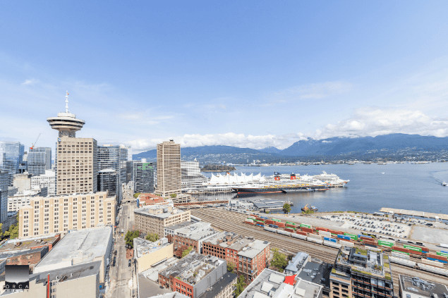 Vibrant Vancouver skyline with harbor views, city skyscrapers, and waterfront, highlighting real estate opportunities and waterfront properties in the heart of downtown Vancouver.