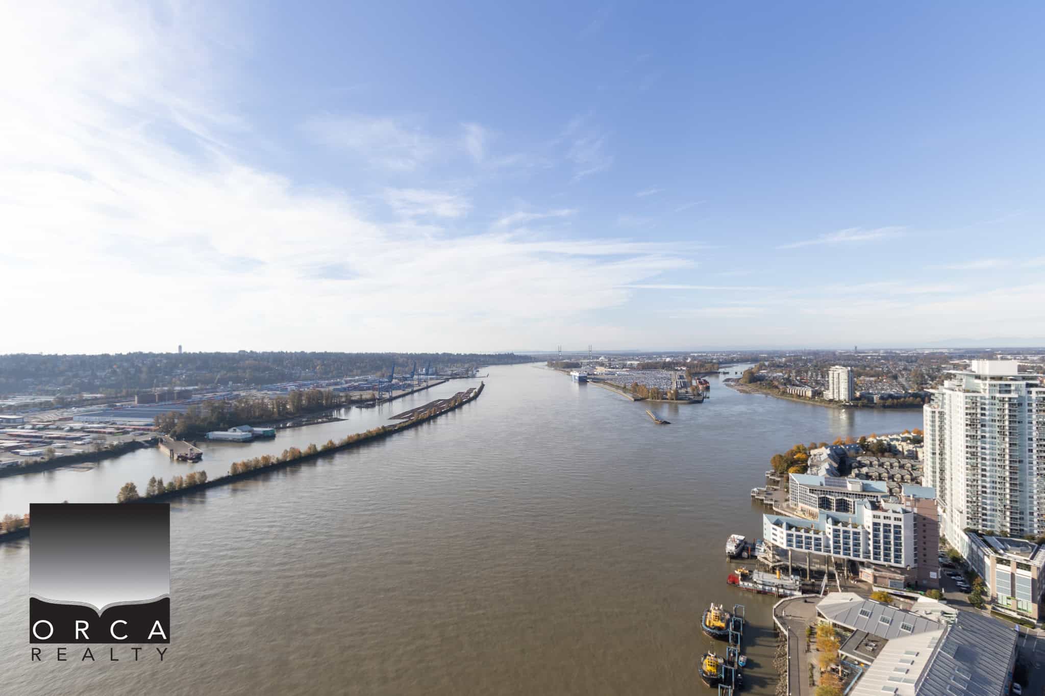 8 Stunning aerial view of Vancouver’s waterfront showcasing urban skyline, river and marina, perfect for Vancouver real estate and property investment with Orca Realty Inc.