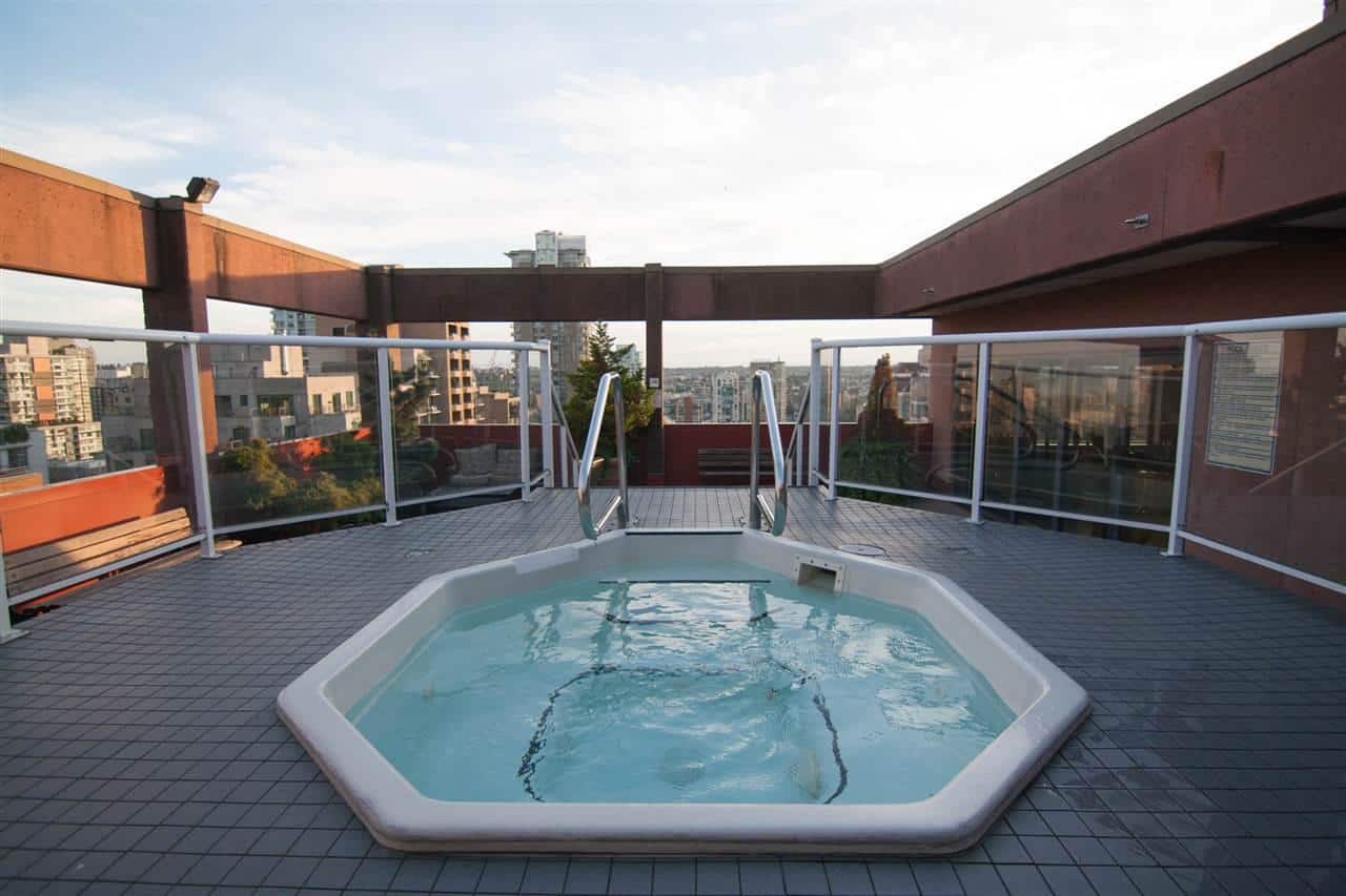 Luxurious rooftop hot tub on a condo terrace with city skyline views in Vancouver, British Columbia. Perfect for relaxation and enjoying urban living in Canada.