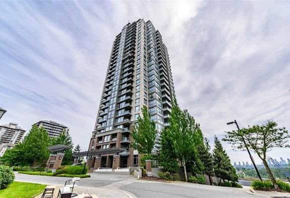 Luxurious high-rise condominium building in downtown Vancouver with modern architecture and city views.