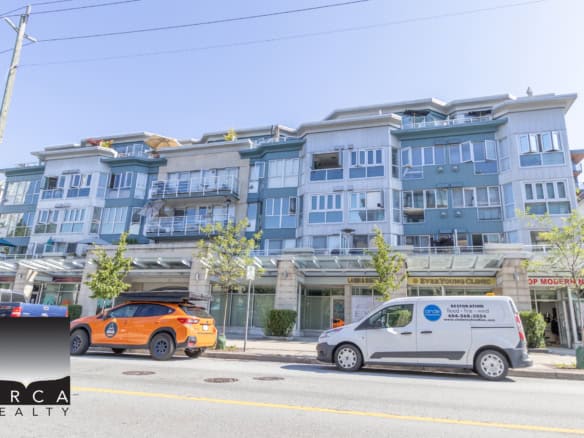 Modern multi-unit residential building with retail storefronts in Vancouver showcasing ocean-side apartment living.