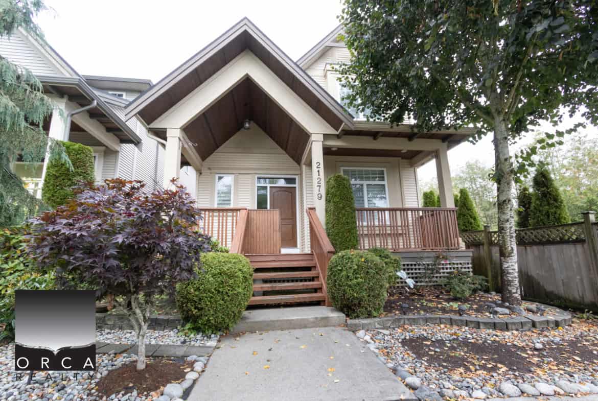 Charming Vancouver home with lush landscaping, inviting porch, and modern exterior, ideal for Pacific Northwest living and real estate investment in BC.