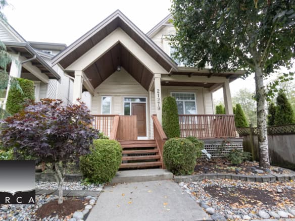 Charming Vancouver home with lush landscaping, inviting porch, and modern exterior, ideal for Pacific Northwest living and real estate investment in BC.