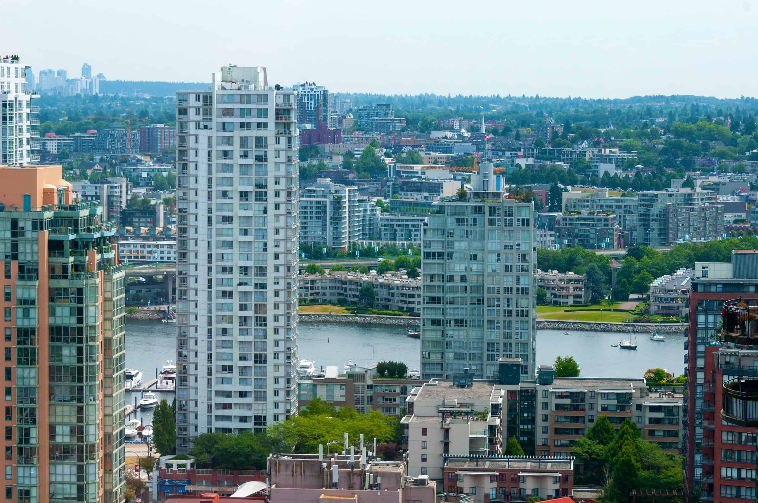 032 Modern high-rise condos overlooking Vancouver Harbour and city skyline, featuring waterfront views, luxurious amenities, and vibrant urban living.