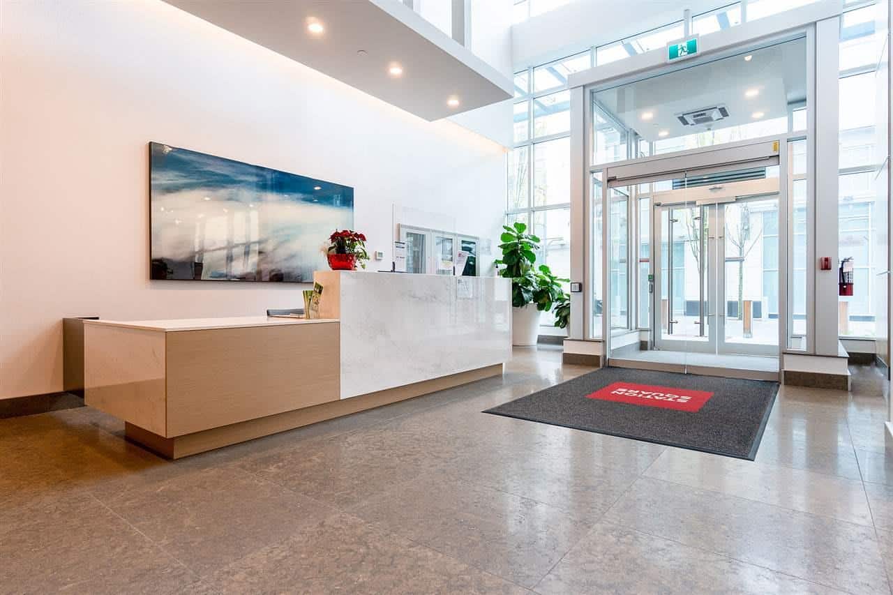 Modern real estate office reception area with bright natural lighting, contemporary decor, and welcoming atmosphere, showcasing Orca Realty Inc. services in Vancouver and Greater Vancouver.