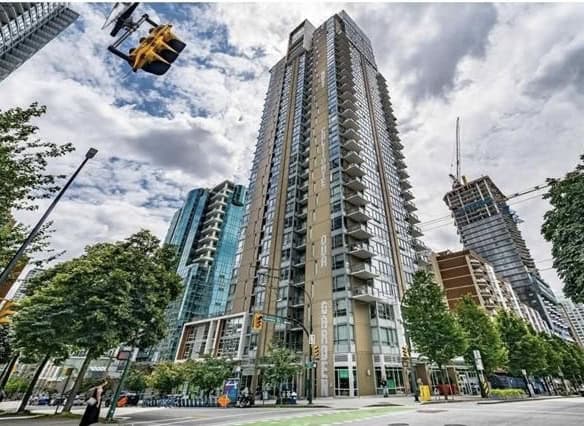 Modern high-rise condominium building in downtown Vancouver, BC, showcasing luxury real estate opportunities.