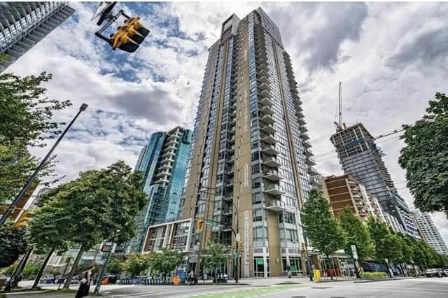 Modern high-rise condominium building in downtown Vancouver, BC, showcasing luxury real estate opportunities.