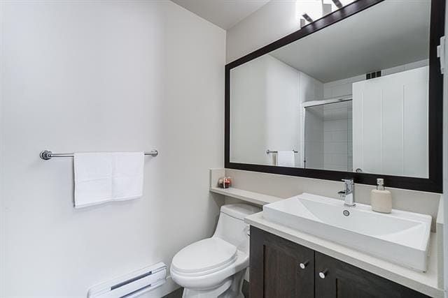 Modern bathroom with white walls, a sleek sink, and a large mirror, expert in residential real estate services offered by Orca Realty Inc.