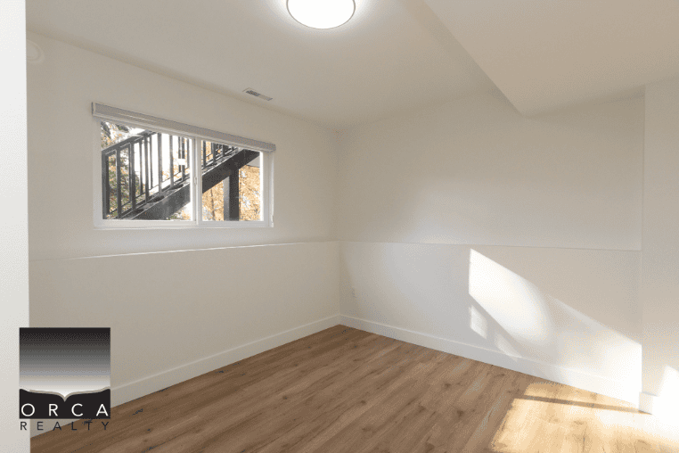 Bright empty room with natural light and window view, ideal for Vancouver real estate, modern home interiors, and property listings.