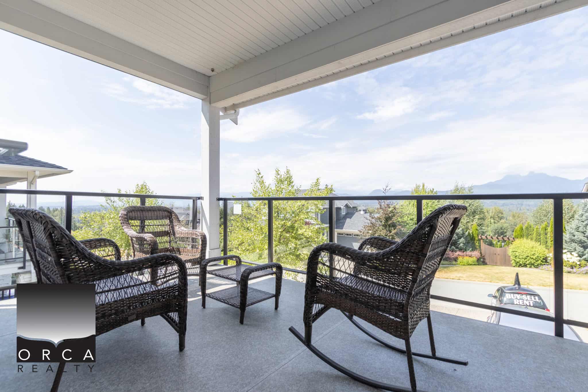 Spacious balcony with outdoor seating overlooking scenic neighbourhood and mountain views, perfect for enjoying Vancouver Island’s natural beauty and ideal for relaxing or entertaining.