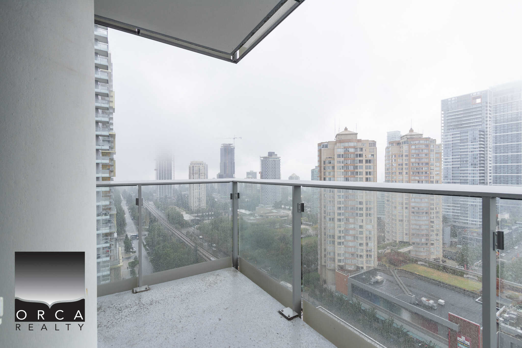 Stunning city skyline view from a modern balcony, perfect for urban living and real estate investment in downtown Vancouver Canada.