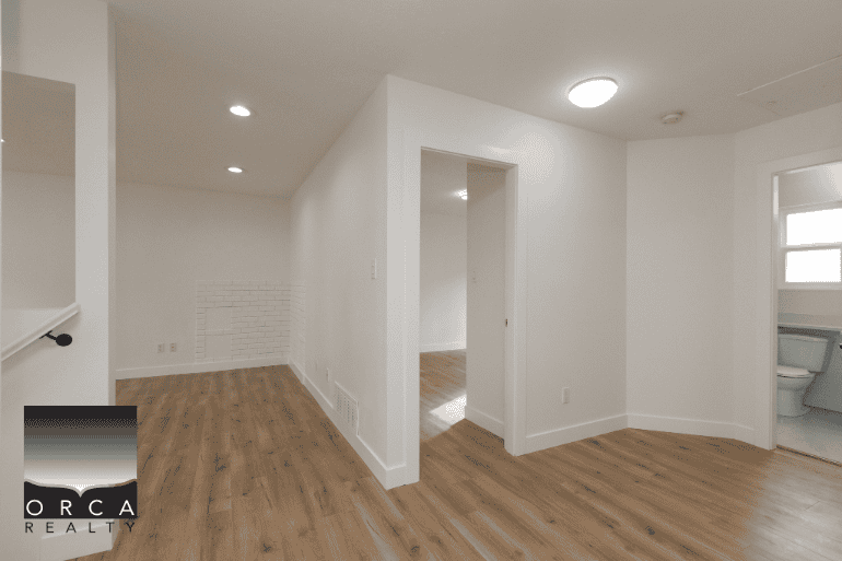 Bright and modern interior of a residential property showcasing clean white walls, hardwood flooring, and spacious living area, ideal for real estate listings and property sales in Ontario.