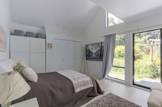 Image-bedroom-with-large-window-and-furniture.jpg.