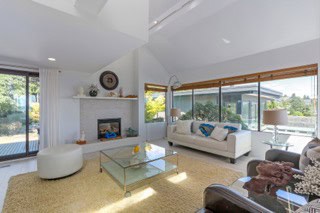 Modern living room with large windows and contemporary furniture in Vancouver, BC.