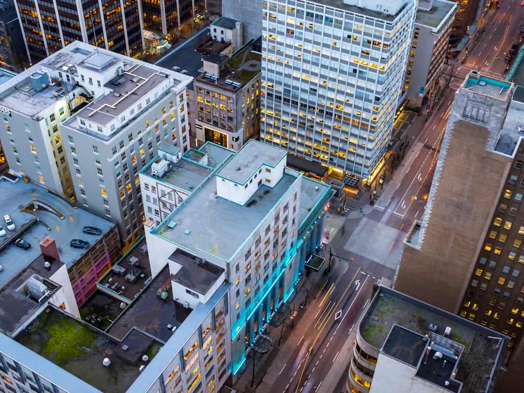 Modern downtown Toronto cityscape with high-rise office buildings and busy streets, showcasing vibrant urban living and commercial real estate opportunities.